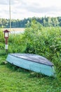 Old wooden boat stored on the lakes shore Royalty Free Stock Photo