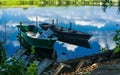 Old wooden boats on the shore of a marshy river. Rustic landscape of Louisiana, USA