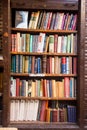 An old wooden bookcase with old books Royalty Free Stock Photo