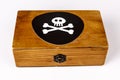 Old wooden box with pirate symbol - skull and bones on black Royalty Free Stock Photo