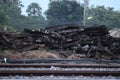 Old wooden boxes, many debris piled up at an outdoor train station. Royalty Free Stock Photo