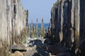 Old wooden breakwater by the sea - rusty water coastal protection