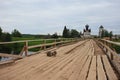 Old wooden bridge across the river. North Russia Royalty Free Stock Photo