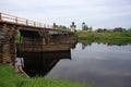 Old wooden bridge across the river. North Russia Royalty Free Stock Photo