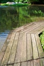 Old wooden bridge along the lake Royalty Free Stock Photo