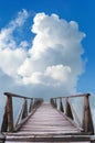 Old wooden bridge, blue sky and white clouds