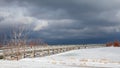 An old, wooden bridge crosses a section of frozen Georgian Bay waterfront in Collingwood