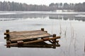 Old wooden bridge on a frozen lake Royalty Free Stock Photo