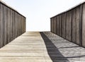 An old wooden bridge leading to nowhere. Concept of alone sadness walk to emptiness. Selective focus Royalty Free Stock Photo