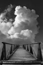 Old wooden bridge leads to unknown against sky and clouds Royalty Free Stock Photo