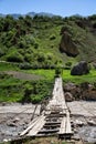 Old, wooden bridge in the mountains of Dagestan Royalty Free Stock Photo