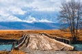 Old wooden bridge over the Chuya river in Altai mountains, Russia Royalty Free Stock Photo