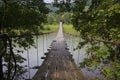 Old wooden bridge over the mountain river Royalty Free Stock Photo