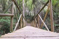 Old, wooden bridge over the river in a forest Greece, Peloponnese Royalty Free Stock Photo