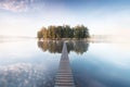 Old wooden bridge in park. Beautiful colored trees with lake in autumn, landscape photography. Summer and Late autumn. Outdoor and Royalty Free Stock Photo