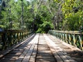 Old wooden bridge in deep forest, natural vintage background Royalty Free Stock Photo