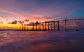 The old wooden bridge and sea wave on the beach at sunset sky background at Khao Pilai, Phangnga, Thailand. Nature landscape Royalty Free Stock Photo