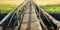 An old wooden bridge. Sunny day. Empty walkway.