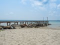 Old wooden Bridge to the blue sea Royalty Free Stock Photo