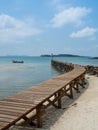 Old wooden Bridge to the blue sea Royalty Free Stock Photo