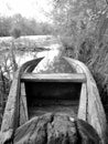 Old wooden broken boat for swimming on banks water in natural reeds Royalty Free Stock Photo