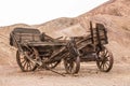 Old wooden broken wagon in calico ghost town Royalty Free Stock Photo
