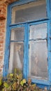 Smashed glass Window with old wooden frame on grunge wall damaged house Royalty Free Stock Photo