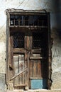 Old wooden brown door in ruin Royalty Free Stock Photo
