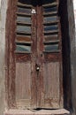 Old wooden brown door in ruin Royalty Free Stock Photo