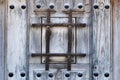 Old wooden brown door with wrought iron details