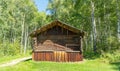 Old wooden building in the forest. Russian barn. ancient, wooden architecture