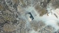 An old wooden building in the middle of a snowy forest, concept of solitude. Clip. Aerial top view of a small house Royalty Free Stock Photo