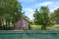 Old Wooden Cabin and Brick Wall Royalty Free Stock Photo