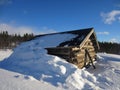 Old wooden cabin in norwegian mountains covered with snow Royalty Free Stock Photo