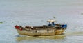 An old wooden cargo vessel sailing along the Soai Rap river