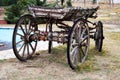 Old wooden cart with four wheel on road Royalty Free Stock Photo