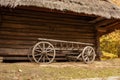 Old wooden cart in front of an old barn. Rural landscape Royalty Free Stock Photo