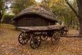Old wooden cart in front of an old barn. Rural landscape Royalty Free Stock Photo
