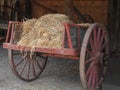 Old wooden cart with hay. Royalty Free Stock Photo