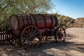 Detail of an old wooden cart with a large barrel in a town in the far west. Is abandoned Royalty Free Stock Photo