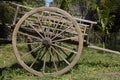 An old wooden cart with large wheels in the farm Royalty Free Stock Photo