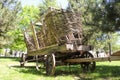 An old wooden cart with large wheels in the farm Royalty Free Stock Photo