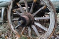 Weathered wooden cartwheel of old farming carriage