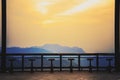 Old wooden chair with high sunrise view on the mountain