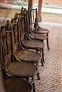 Old wooden chairs in the aisles Royalty Free Stock Photo