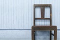Old wooden chairs on blue wood wall Royalty Free Stock Photo