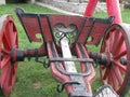 Old wooden chairs and red wooden cart Royalty Free Stock Photo