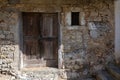 Old wooden characteristic door and small window on the facade of ancient wall in the town of TopolÃÂ² or topolove. Royalty Free Stock Photo