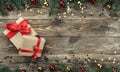 Old wooden Christmas background. Fir branches with baubles and gold stars. Xmas gifts. Top view Royalty Free Stock Photo