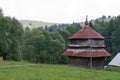 Old wooden church with a brown roof in Transcarpathia